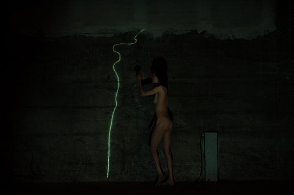 Image 8: drawing with light on the concrete wall.